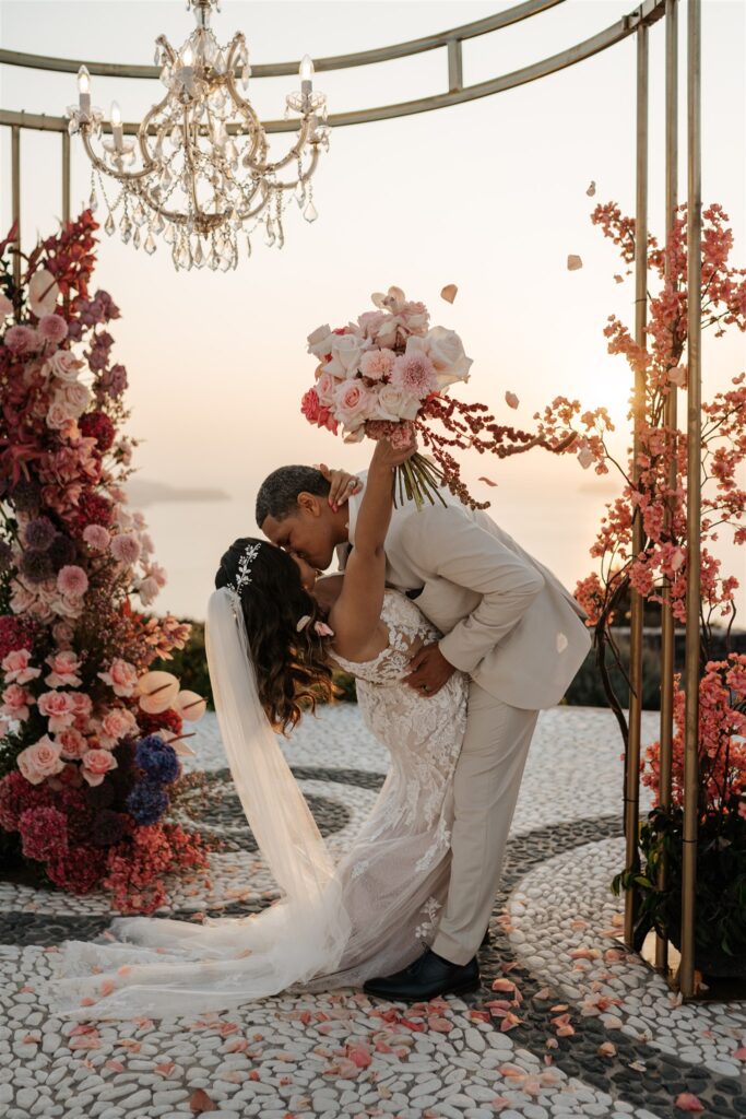 Romantic vow renewal in santorini with beautiful flowers