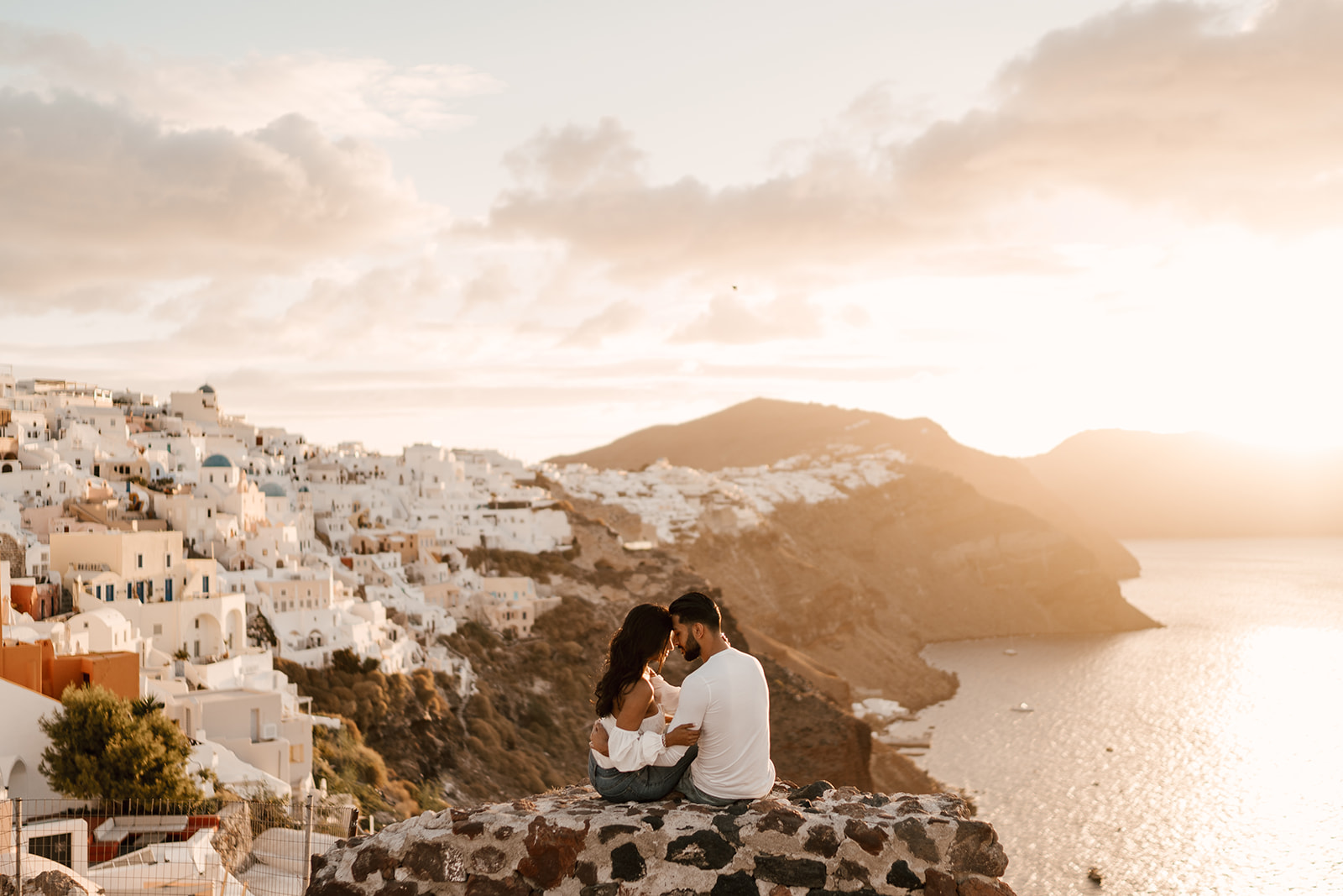 Couple at sunrise in Oia santorini