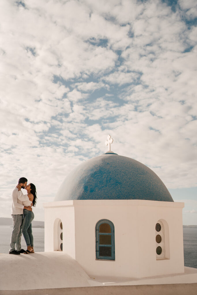 Couple photoshoot in Santorini at blue domes