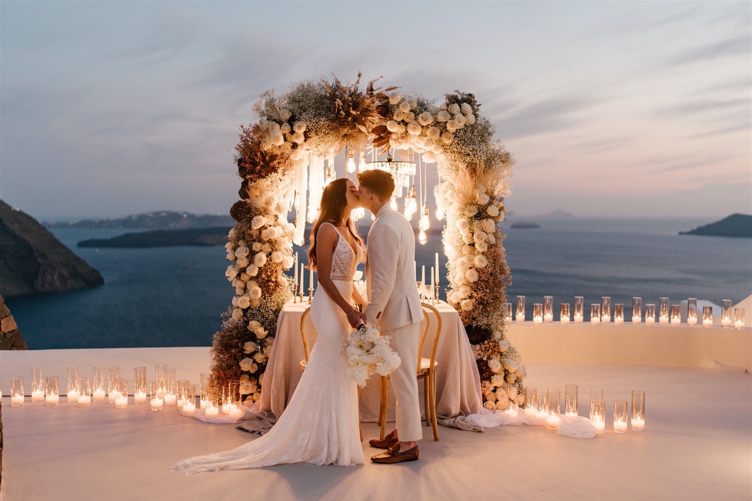 Bride And Groom Kissing At Sunset Newly Weds At Aenon Villas.jpg