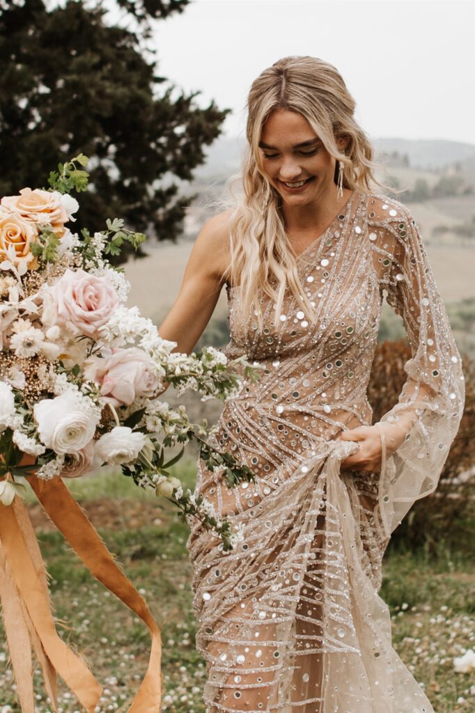 Romantic Tuscany Elopement bride walking with her wedding Bouqet
