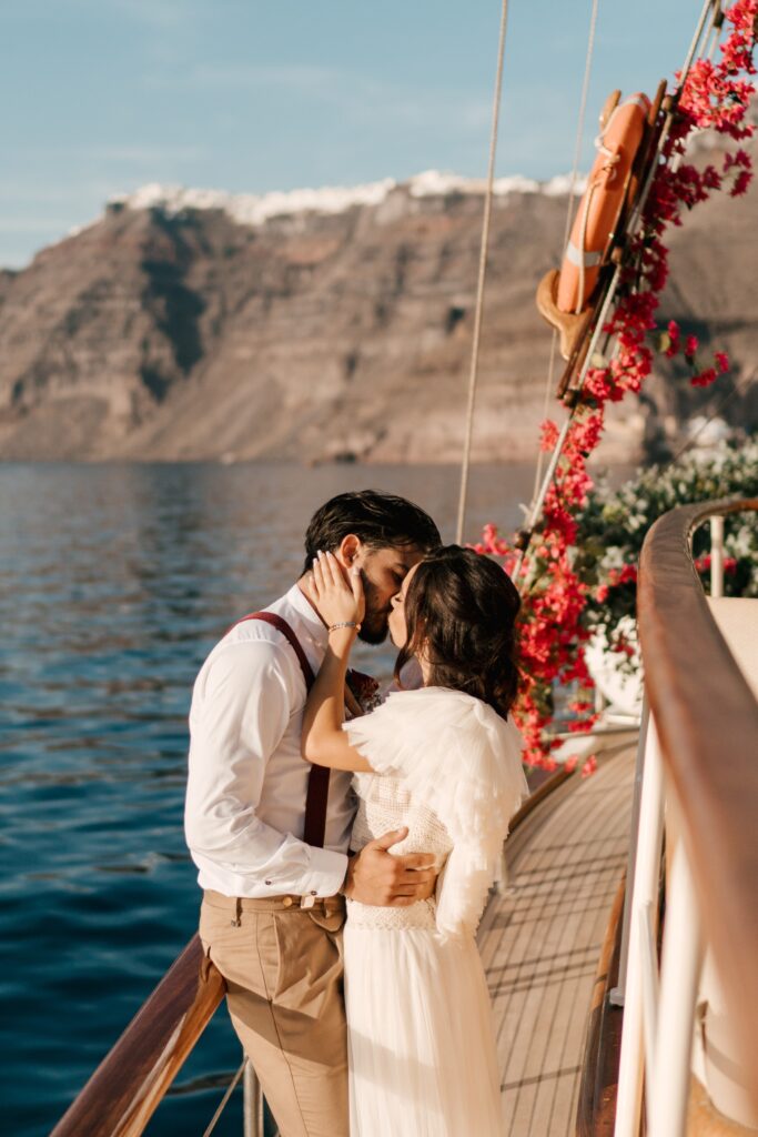 Kissing The Bride – Yacht Wedding In Santorini Phosart Photography Cinematography